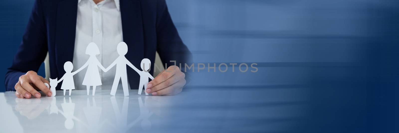 Digital composite of Paper Cut Out family in business persons hands