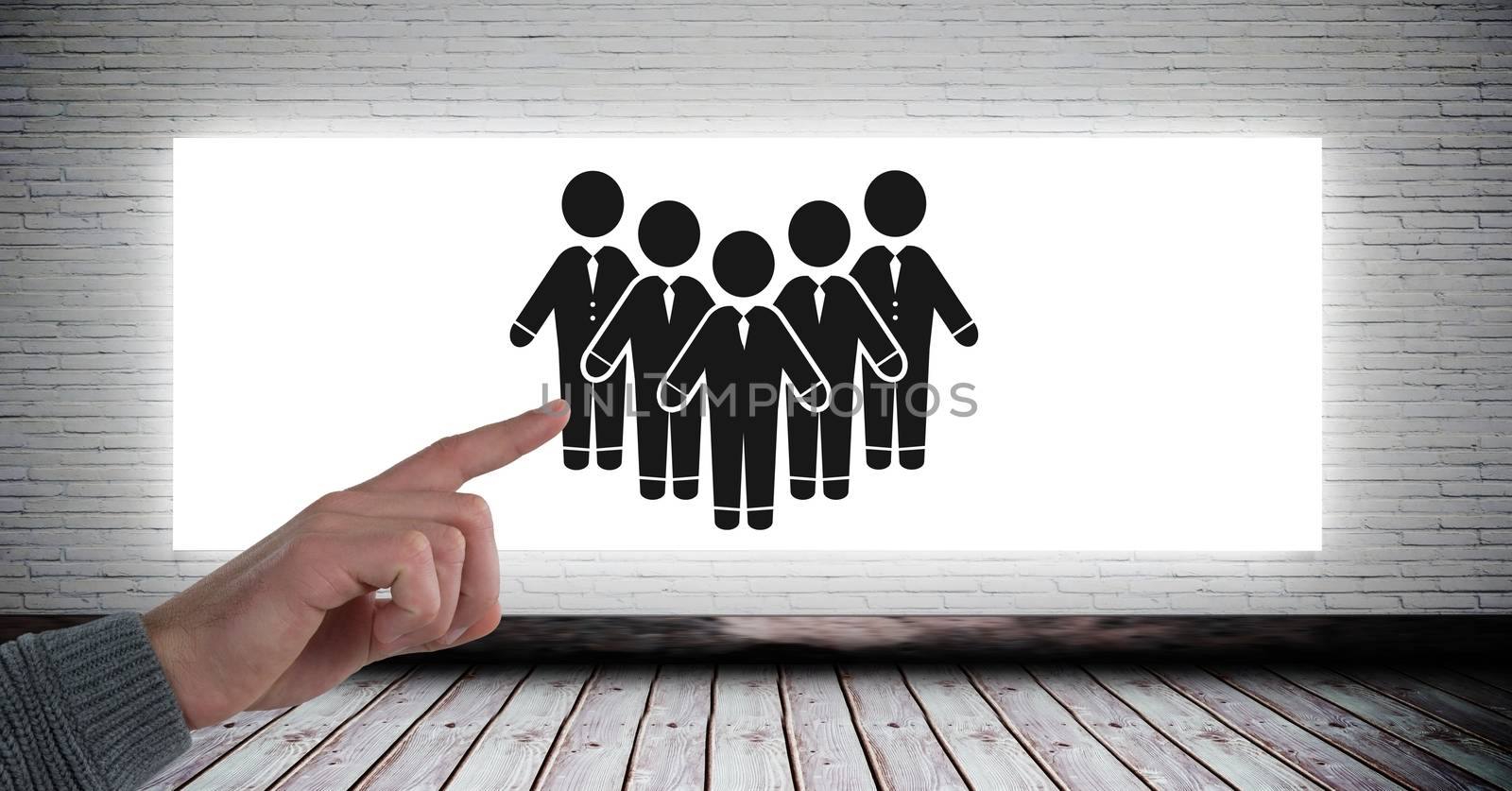 Digital composite of Hand pointing at people group icon