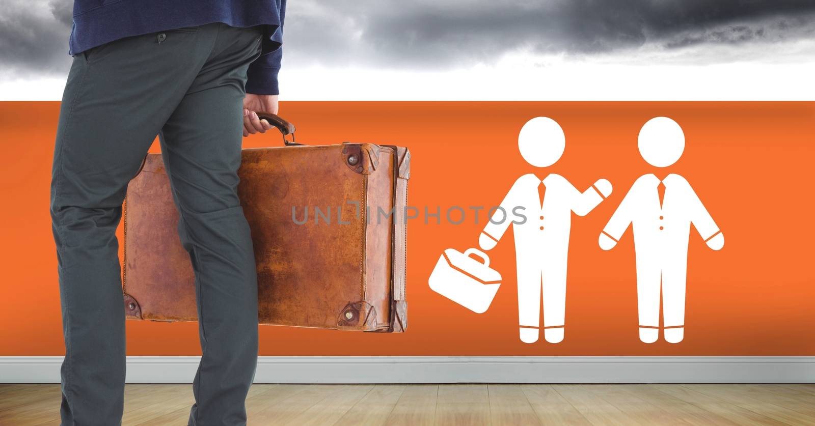 Digital composite of Businessman with briefcase and people meeting icon on wall