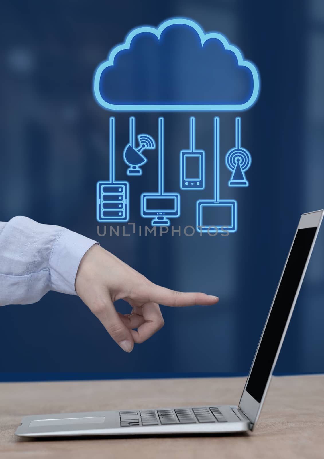 Digital composite of Hand pointing at laptop with cloud icon and hanging connection devices