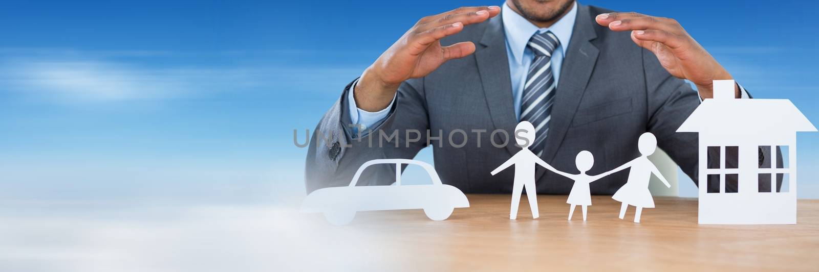 Digital composite of Paper Cut Out family home and car with businessman's hands