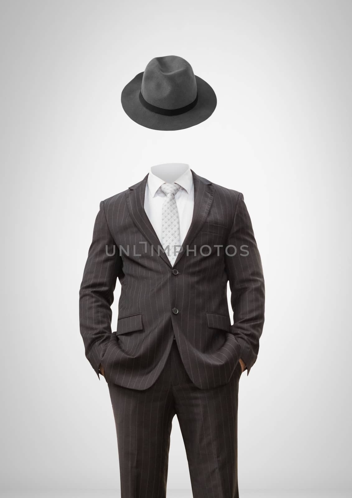 Digital composite of Headless man with surreal floating hat