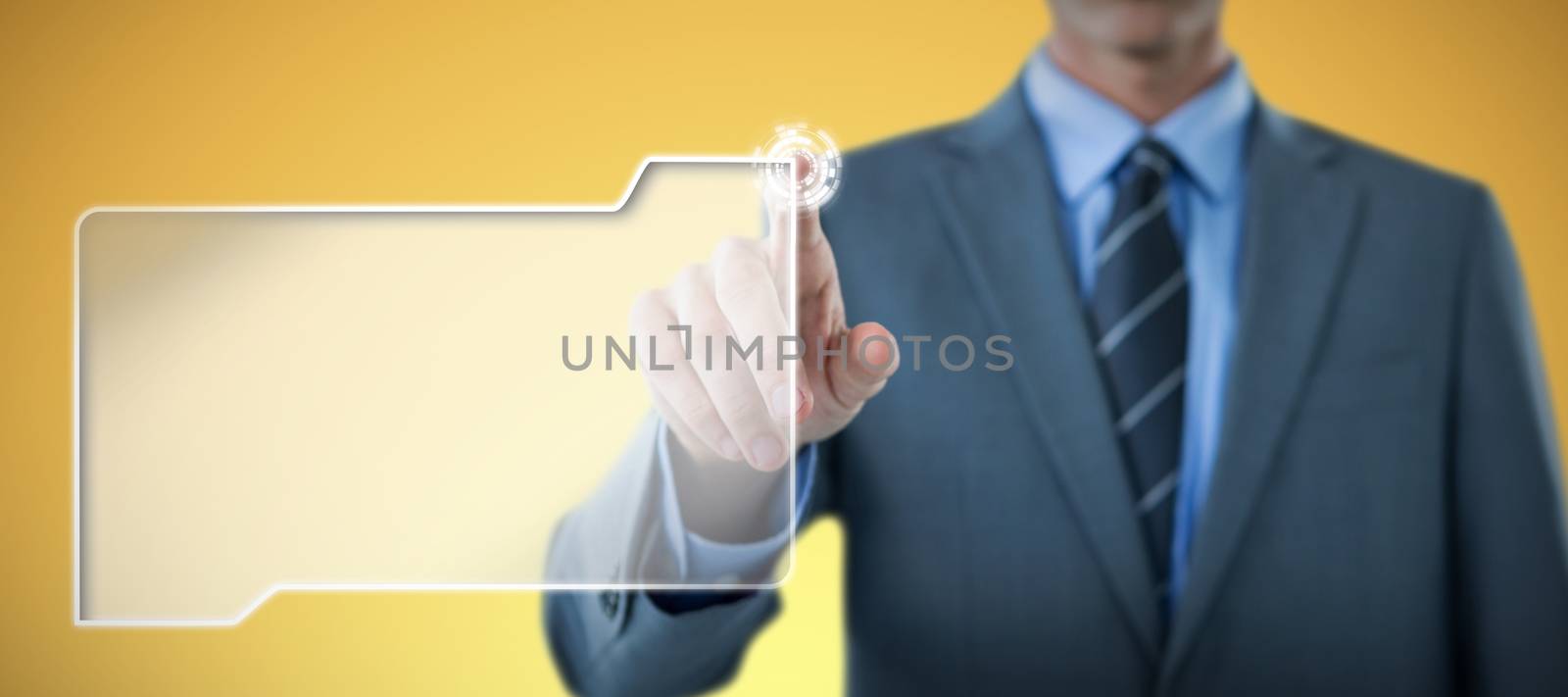 Well dressed businessman pointing against abstract yellow background
