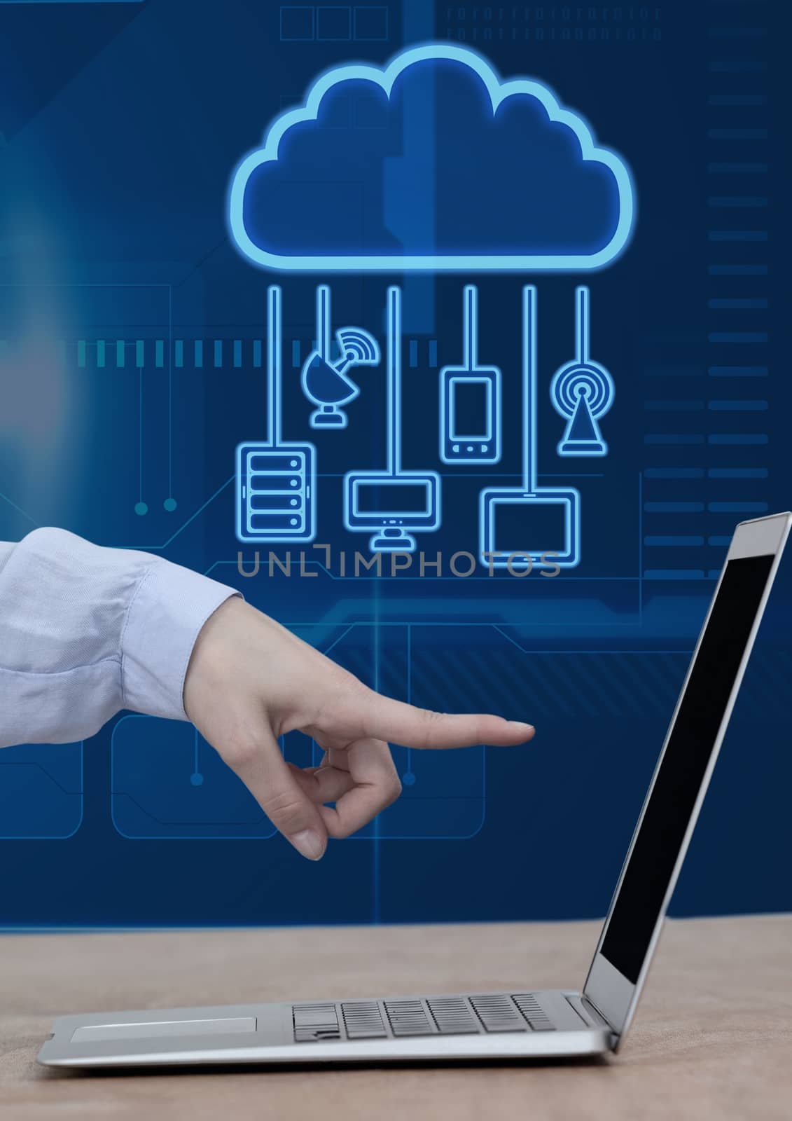 Digital composite of Hand pointing at laptop with cloud icon and hanging connection devices and technology background