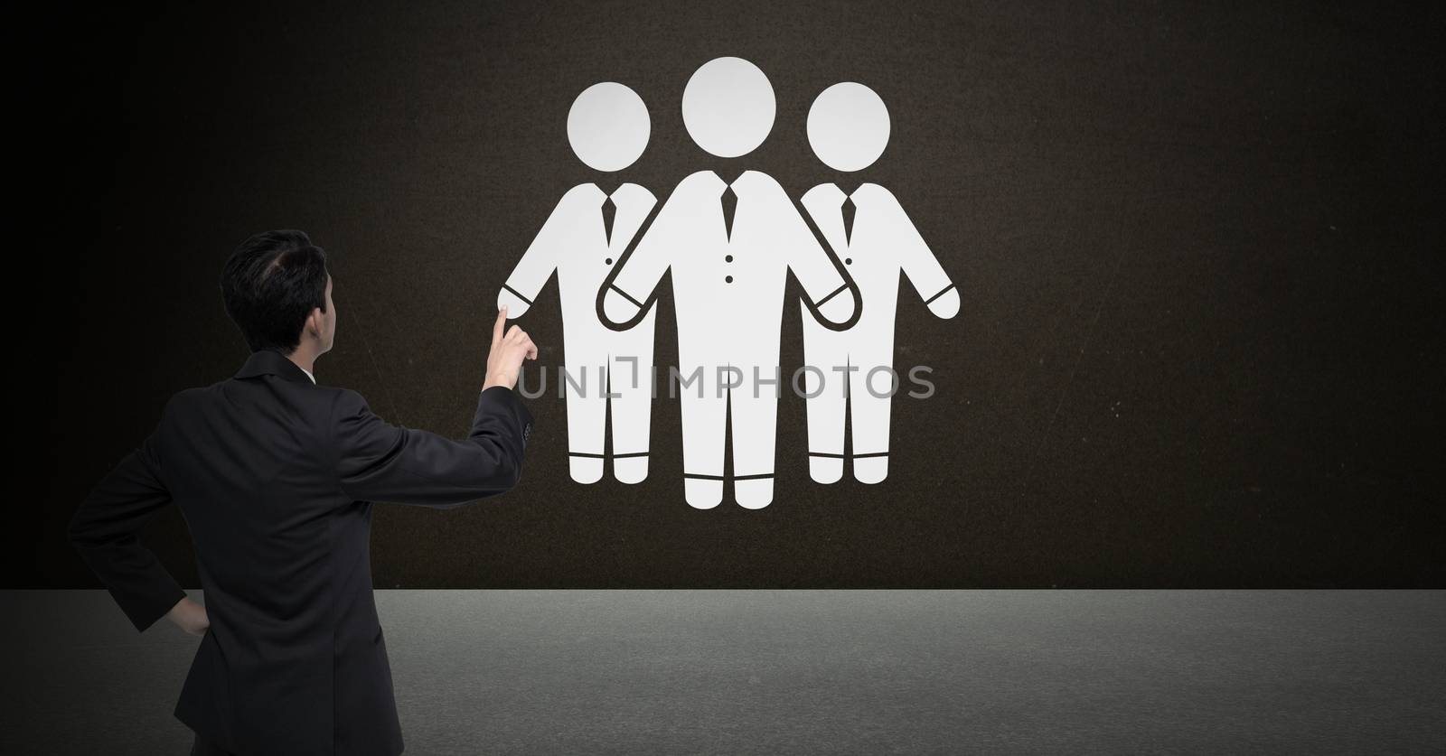 Digital composite of Business people group icon and businessman pointing