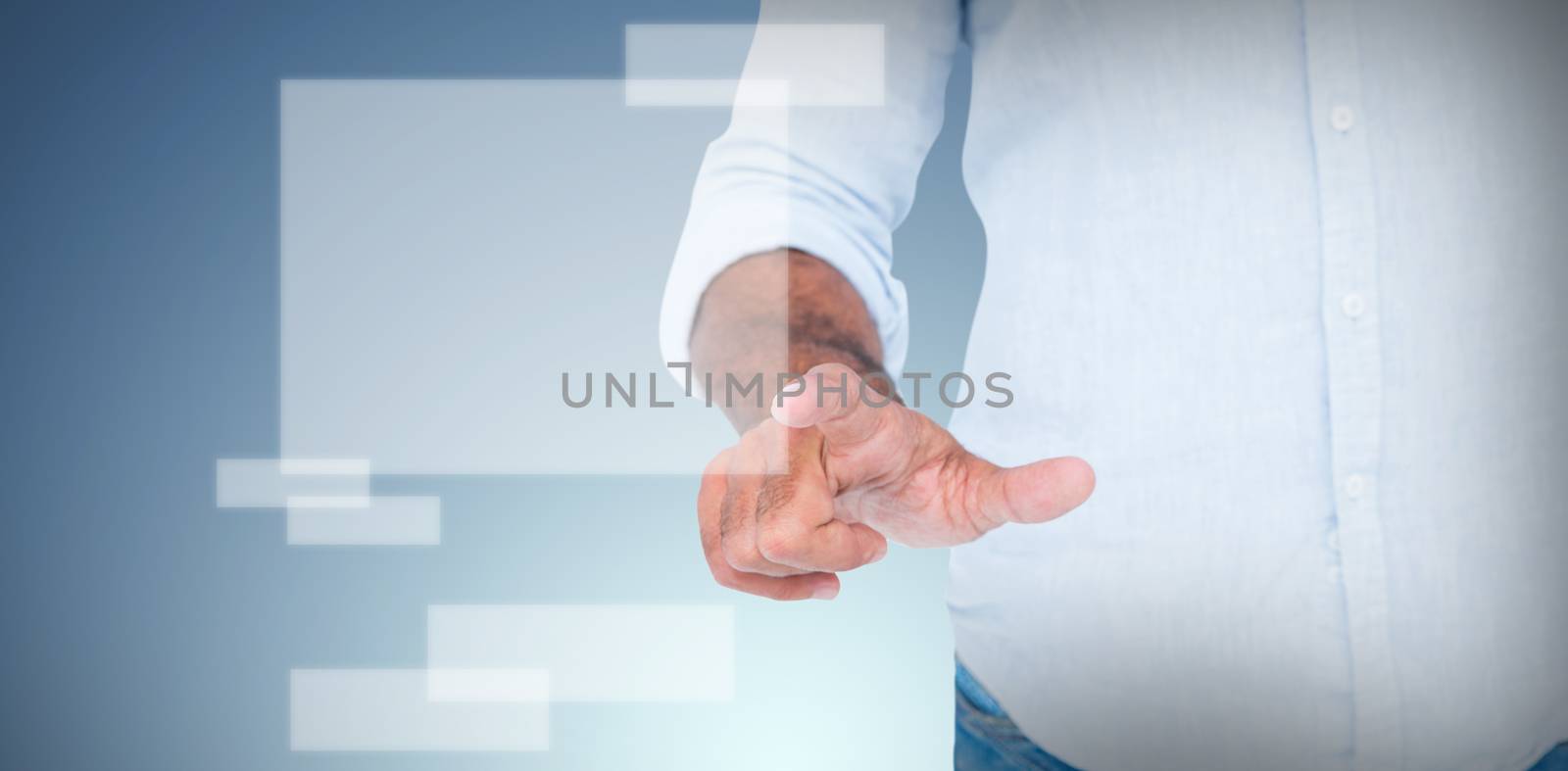 Man pointing something with his finger  against abstract blue background