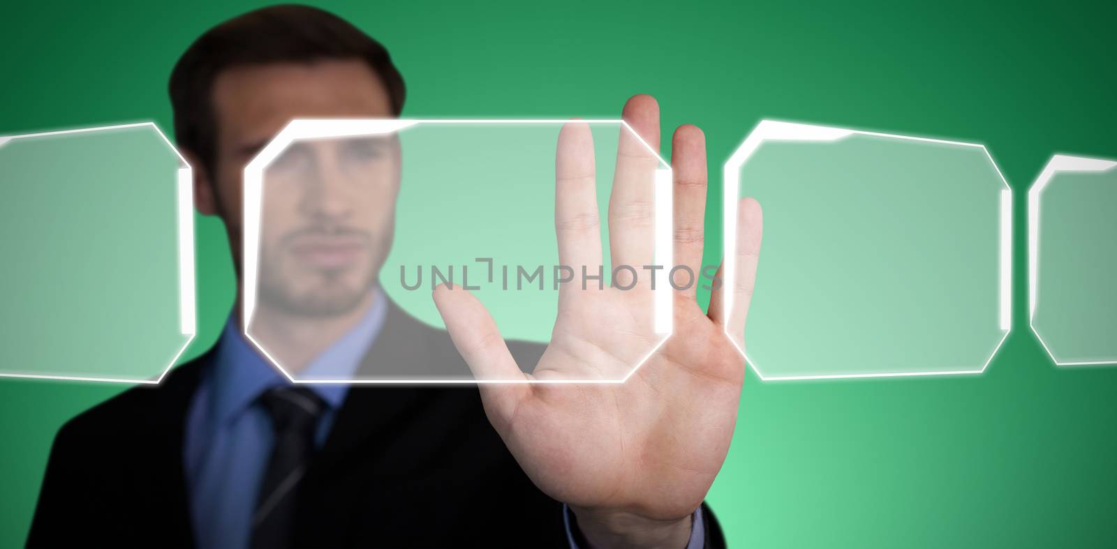 Composite image of close up of businessman touching palm on invisible interface by Wavebreakmedia