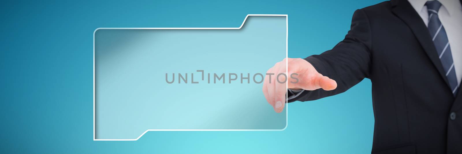 Businessman in suit pointing his finger against abstract blue background
