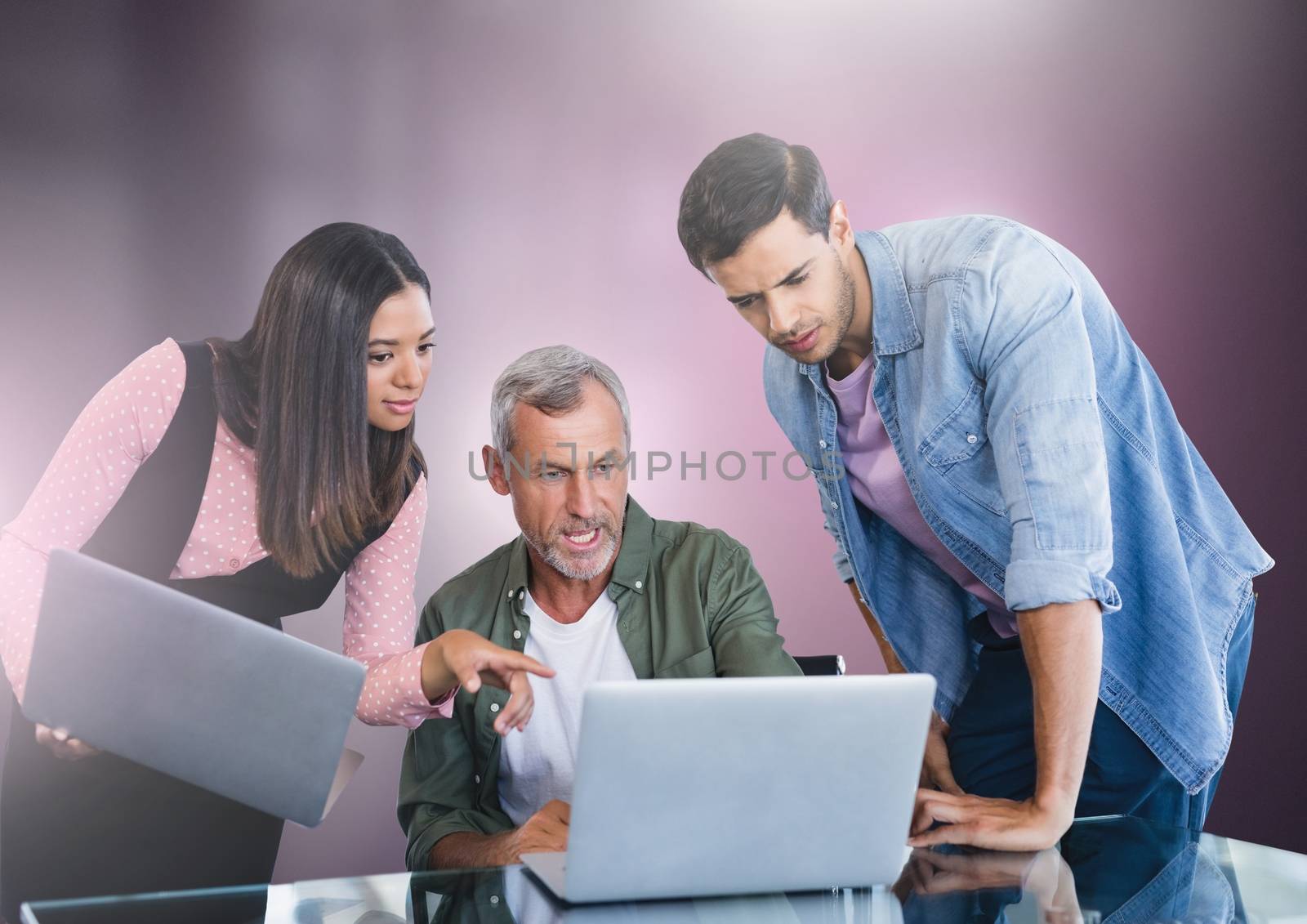 Digital composite of Business people working on laptop