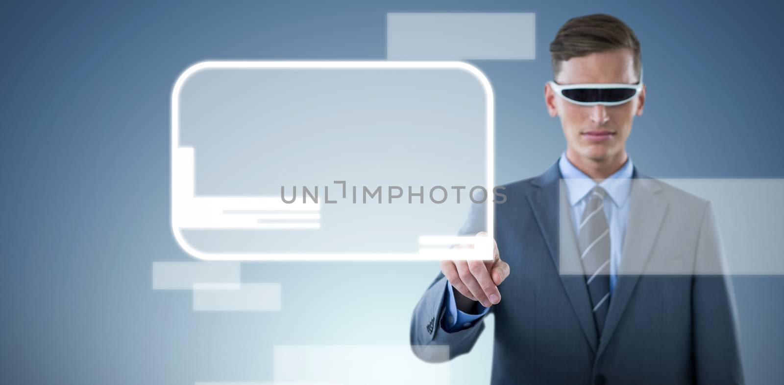 Confident businessman pointing finger while using virtual reality glasses against abstract blue background