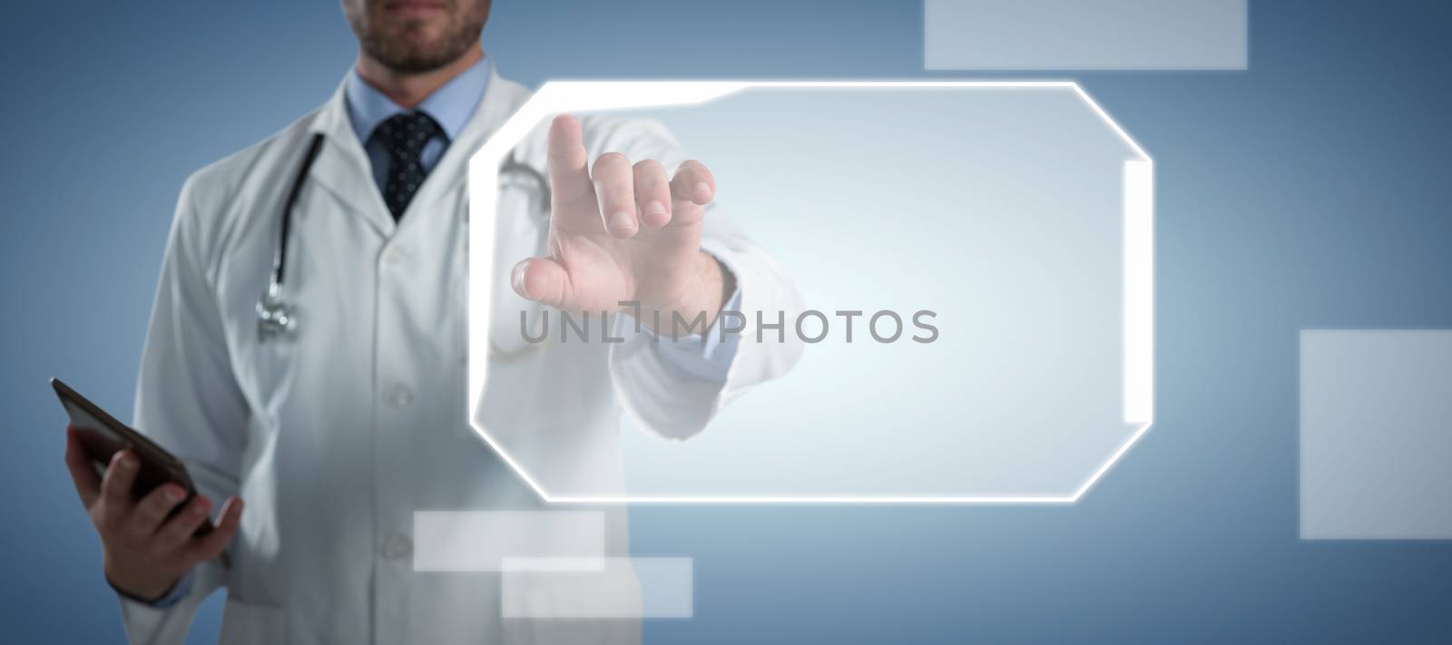 Male doctor using invisible screen against abstract blue background