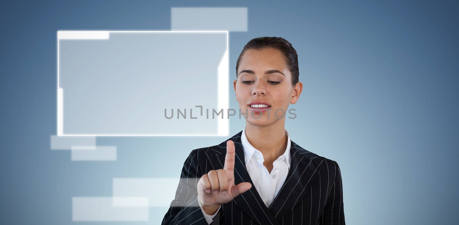 Businesswoman in suit touching invisible interface against abstract blue background