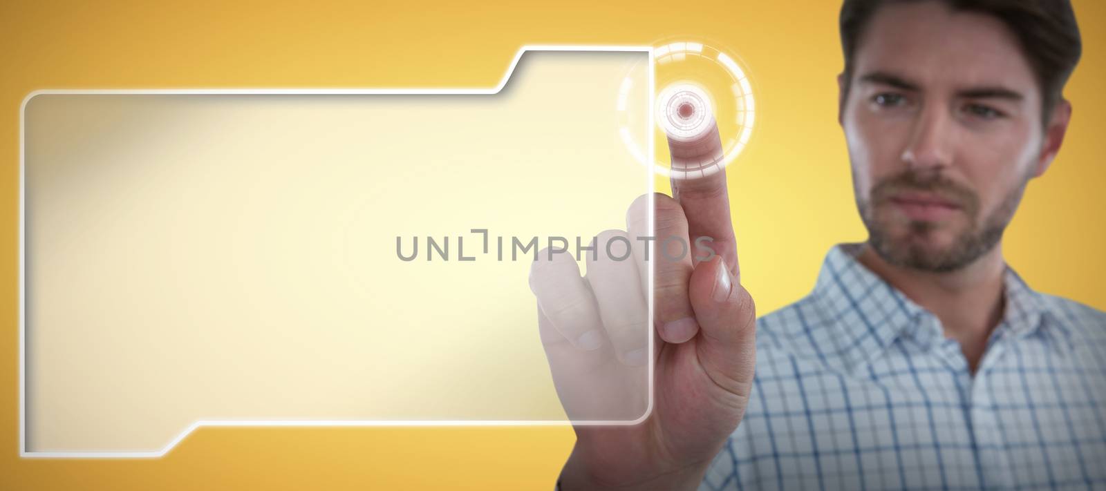 Man pretending to touch an invisible screen against abstract yellow background