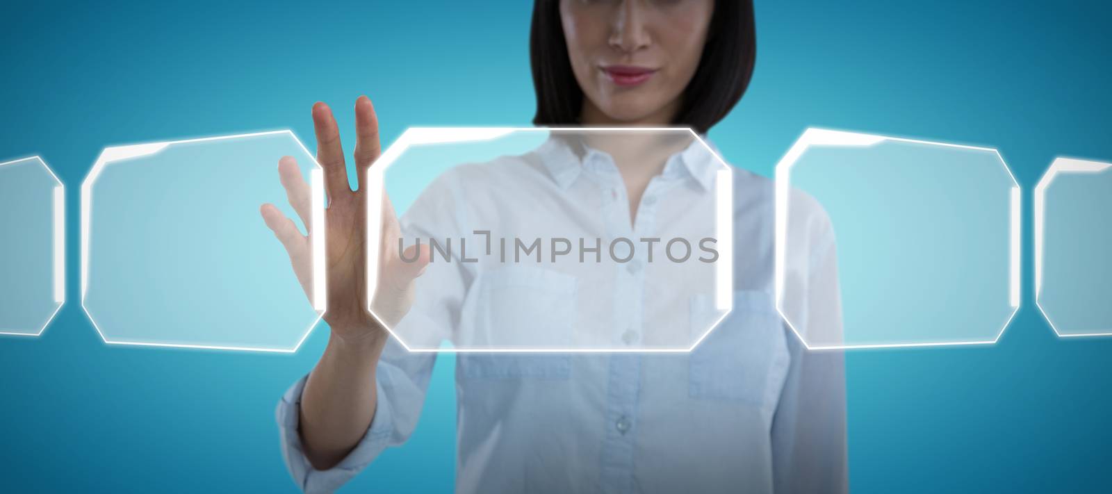 Woman using invisible screen against abstract blue background