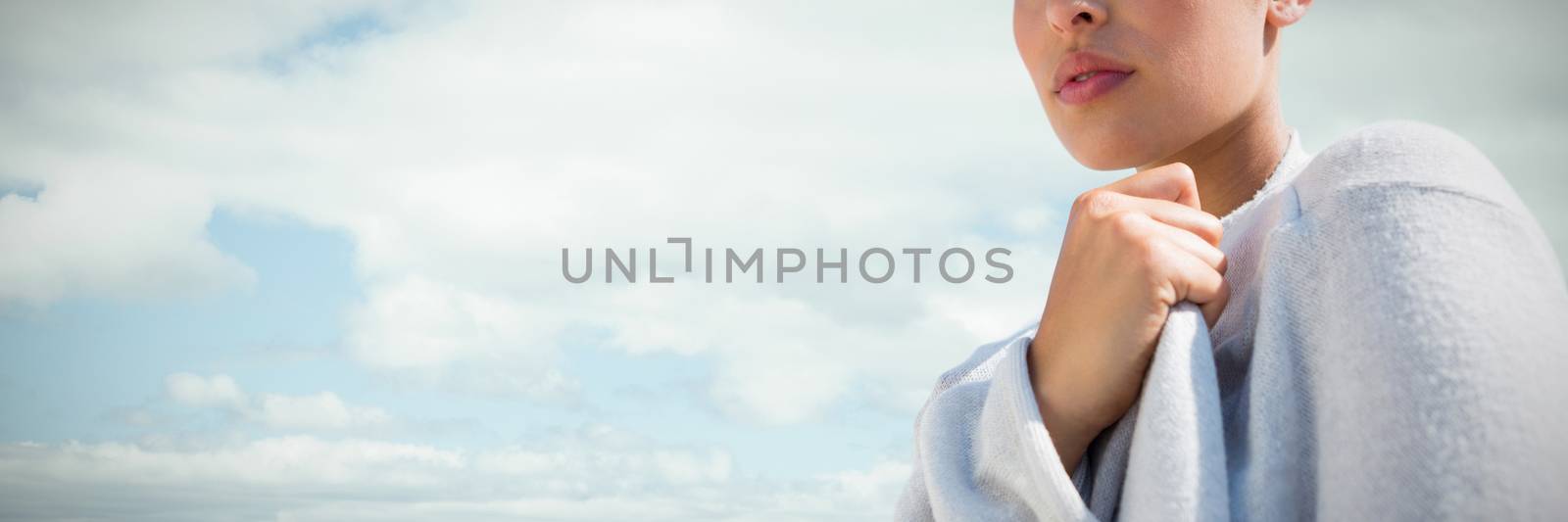 Closeup beauty portrait of a young beautiful woman against landscape