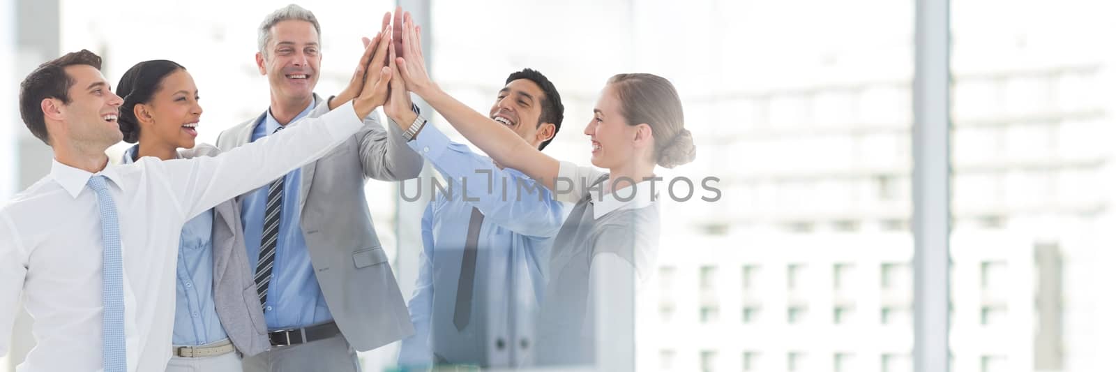 Teamwork transition with business people joining hands by Wavebreakmedia