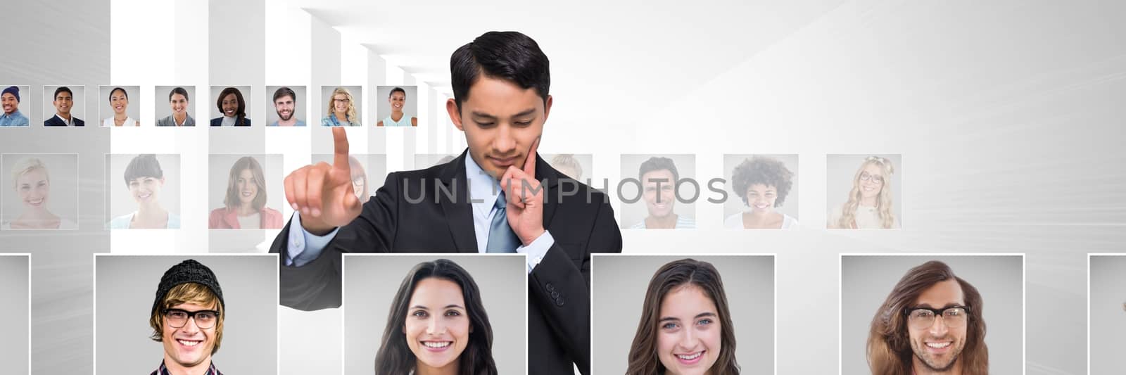 Digital composite of Man touching portrait profiles of different people