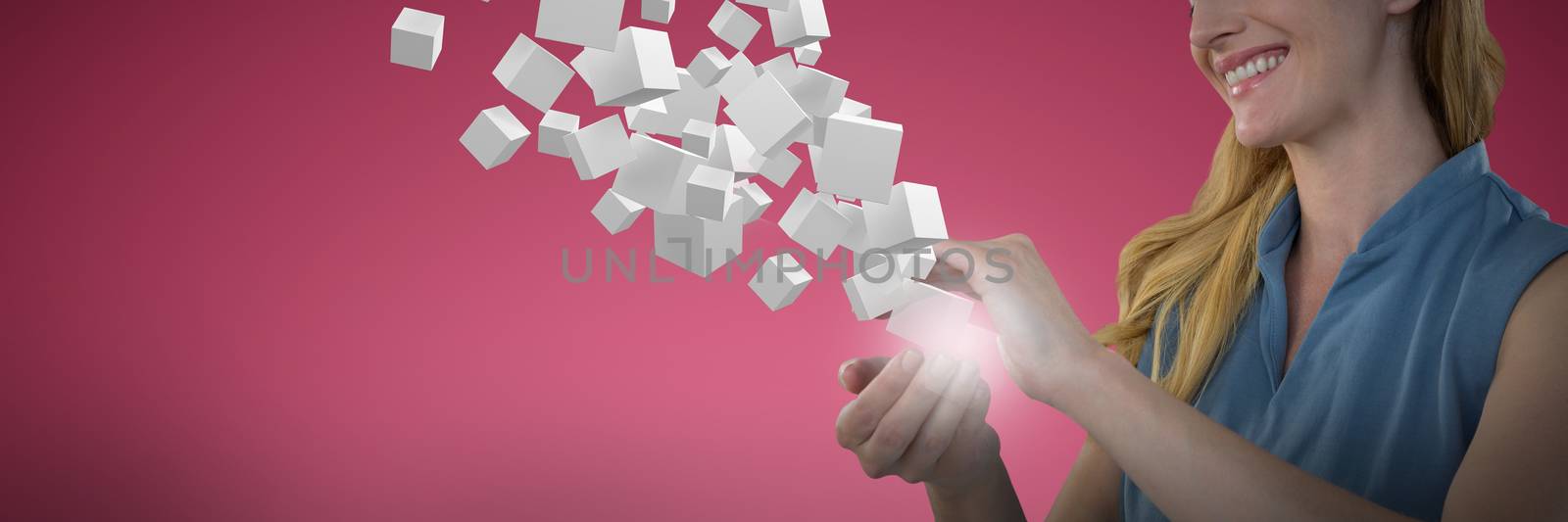 Businesswoman looking at object against abstract maroon background