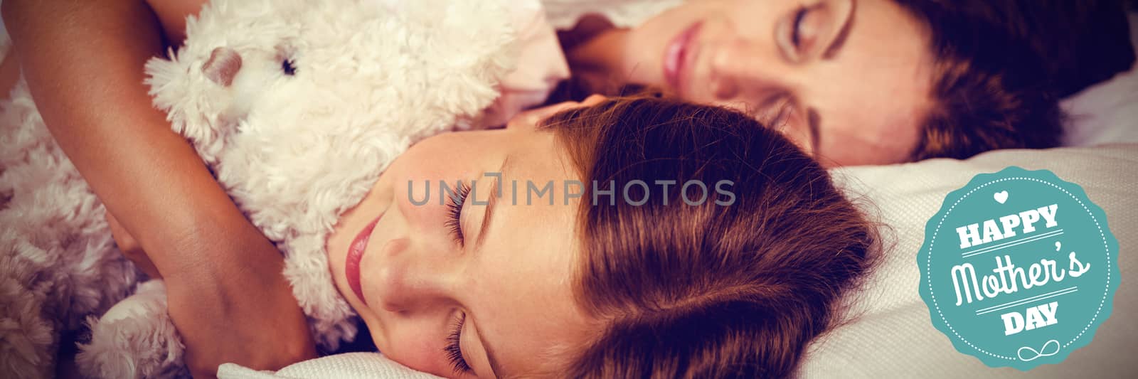 mothers day greeting against high angle view of family sleeping on bed