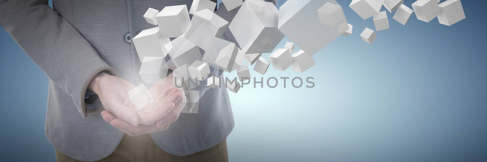 Mid-section of businessman holding object against abstract blue background