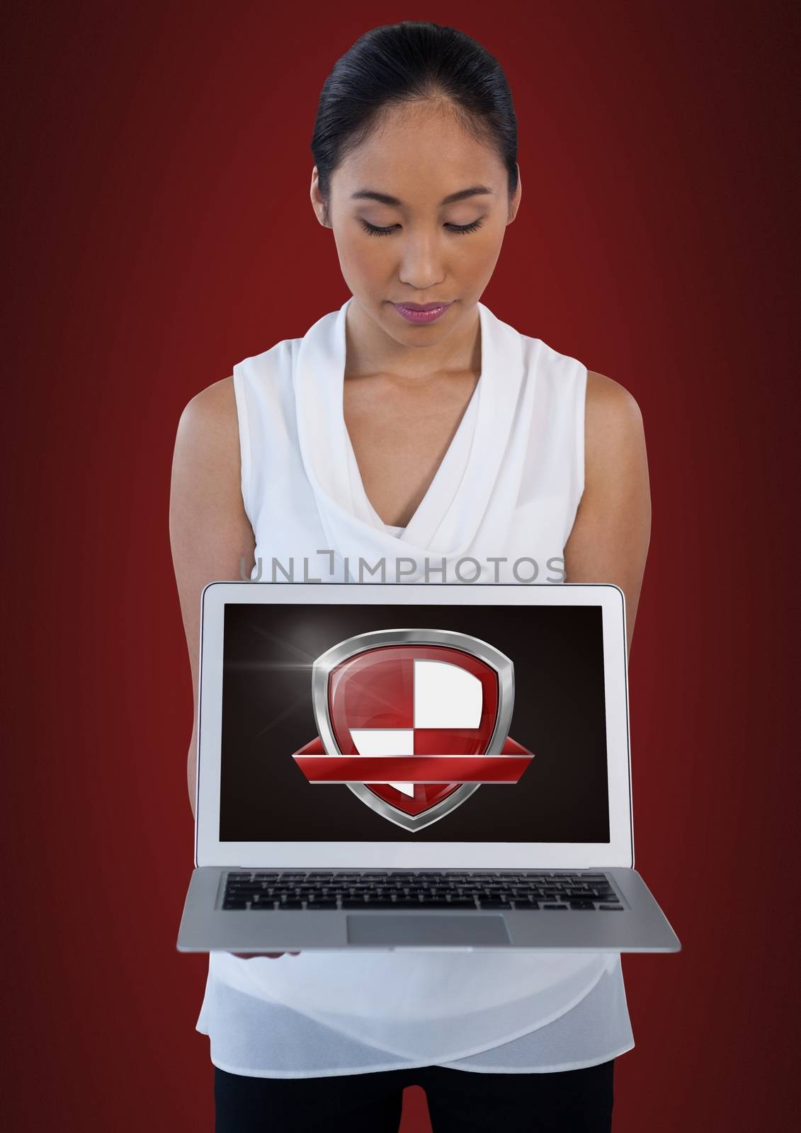 Digital composite of Antivirus security protection shield on woman's laptop