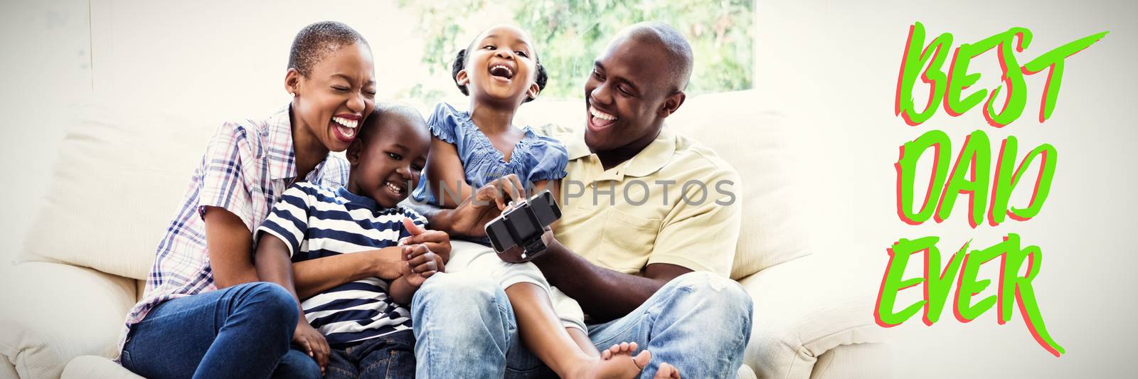 Close up of green text best dad ever against happy smiling family on couch 