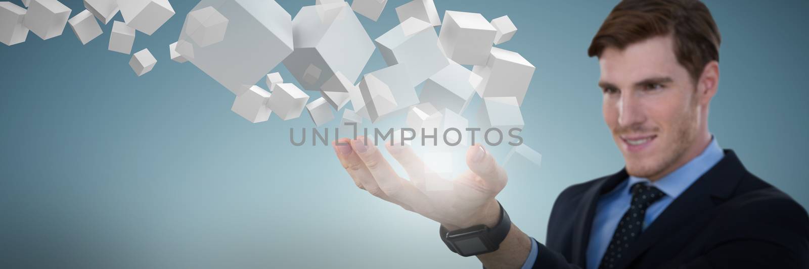 Close-up of businessman presenting object against abstract grey background
