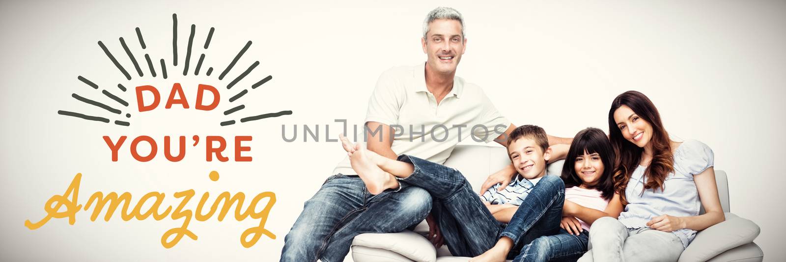 Family sitting on sofa smiling at camera  against close up of dad you are amazing text