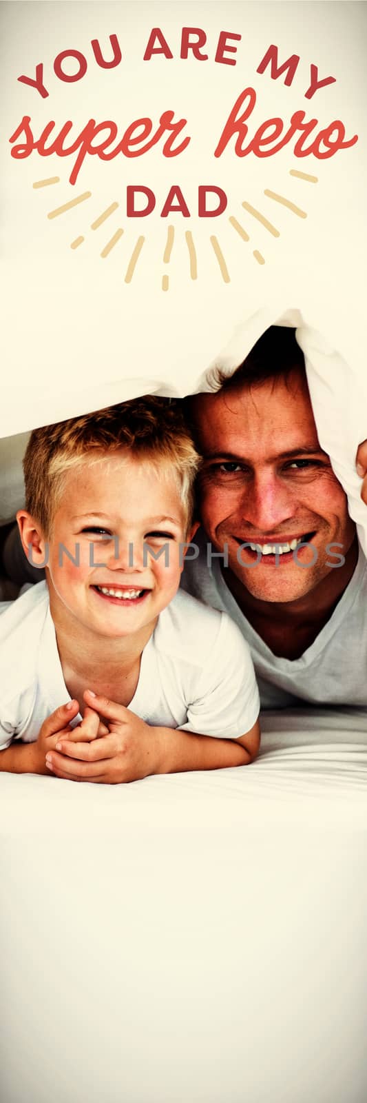 Young family playing together on a bed  against close up of you are my super hero dad text