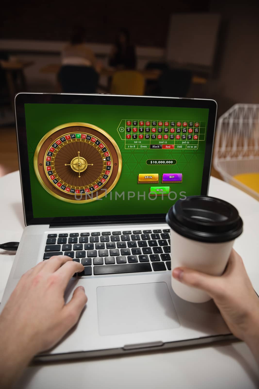 Online Roulette Game  against executive using laptop in office