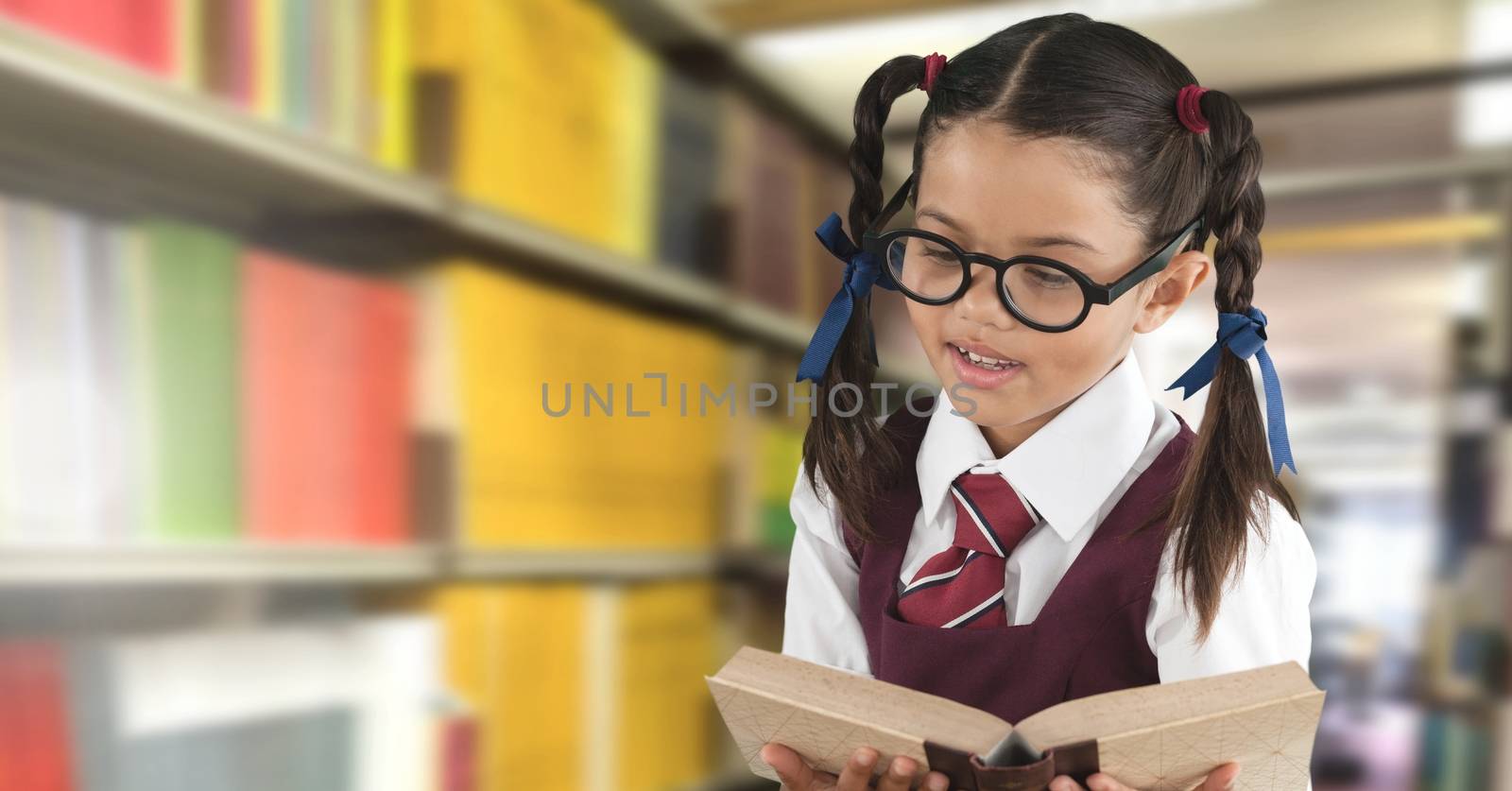 School girl in education library by Wavebreakmedia
