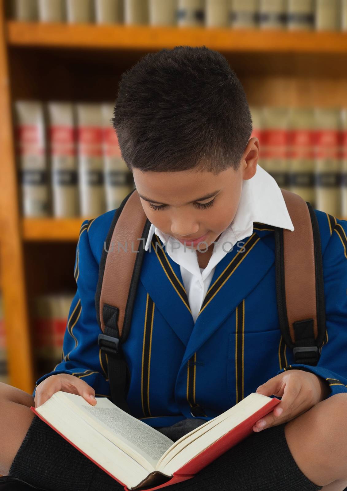 Digital composite of Boy reading in education library