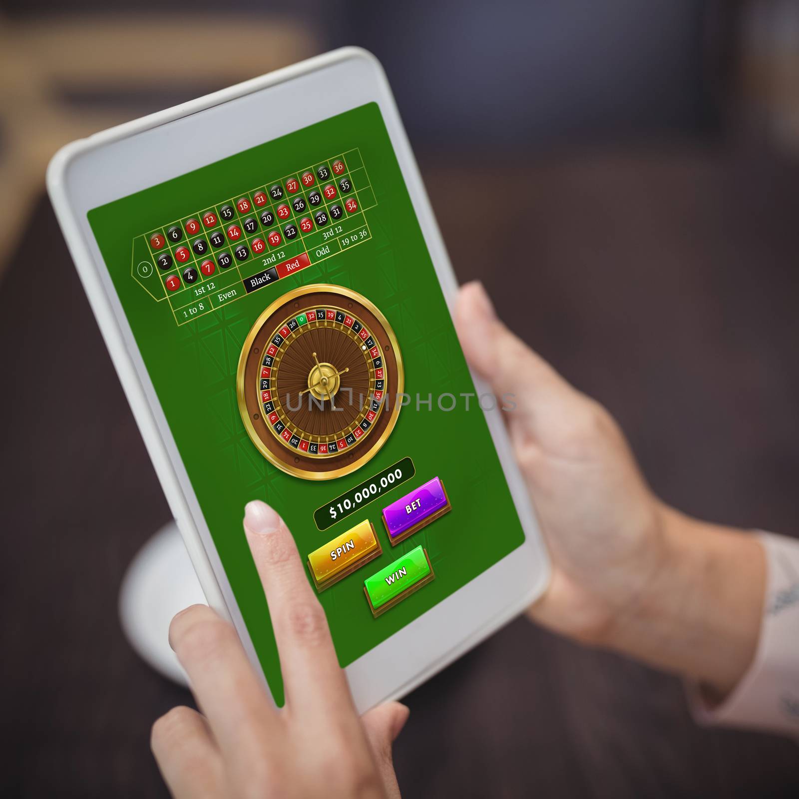 Online Roulette Game  against close-up of woman hands using digital tablet