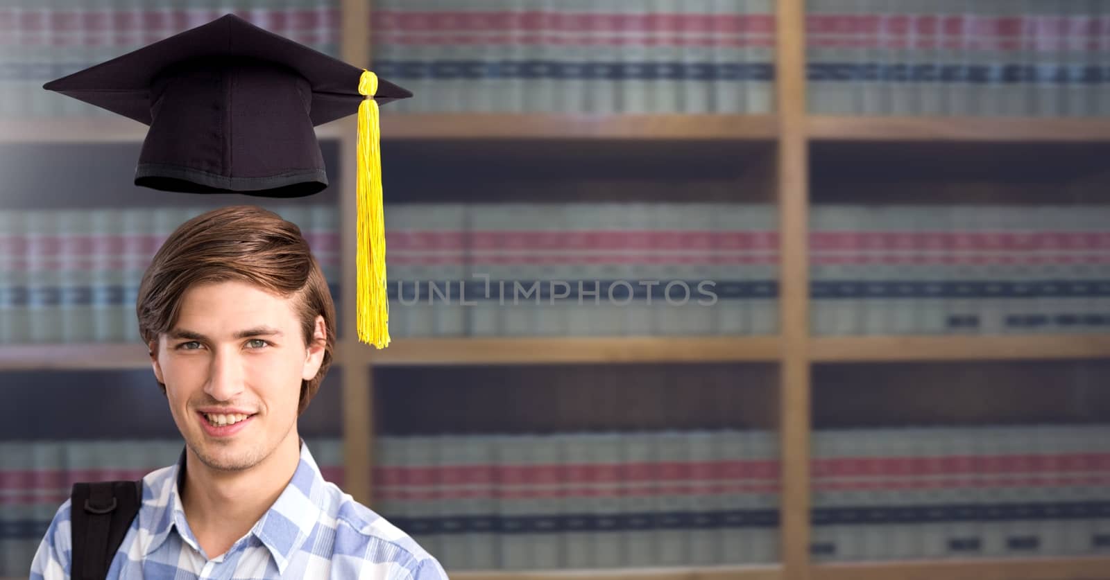 Digital composite of Student man in education library with graduation hat
