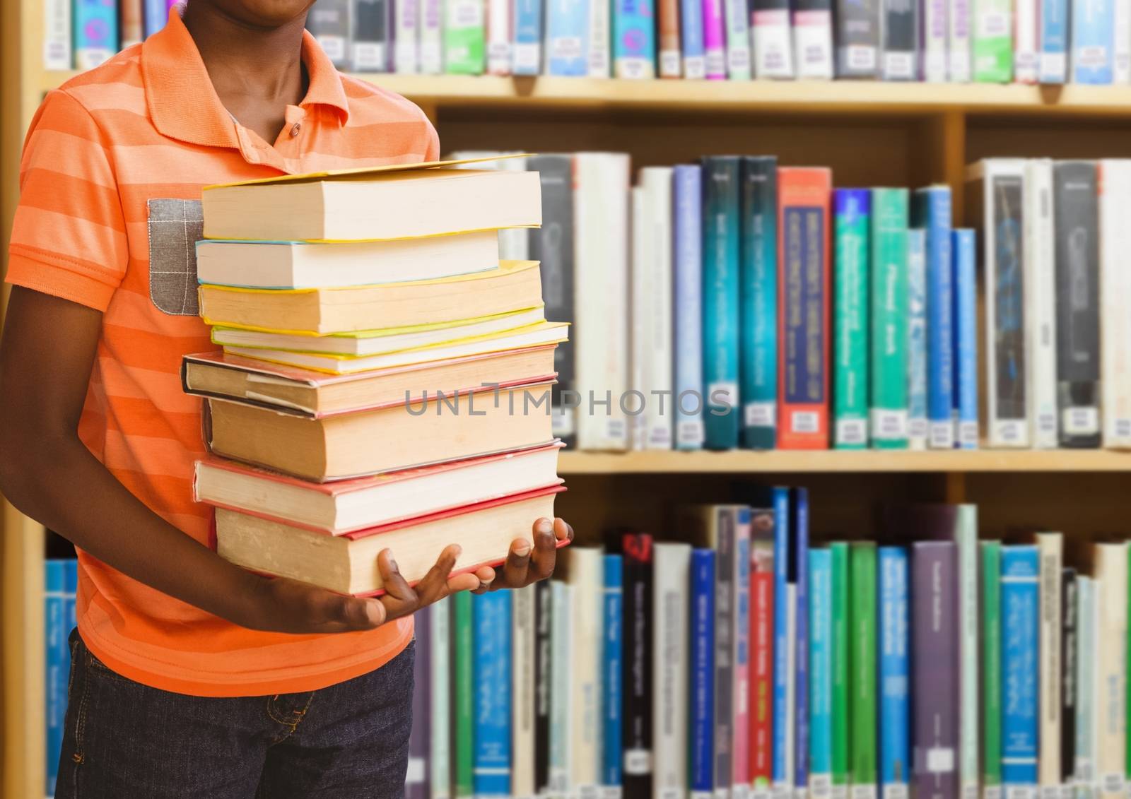 Digital composite of Boy holding books in education library