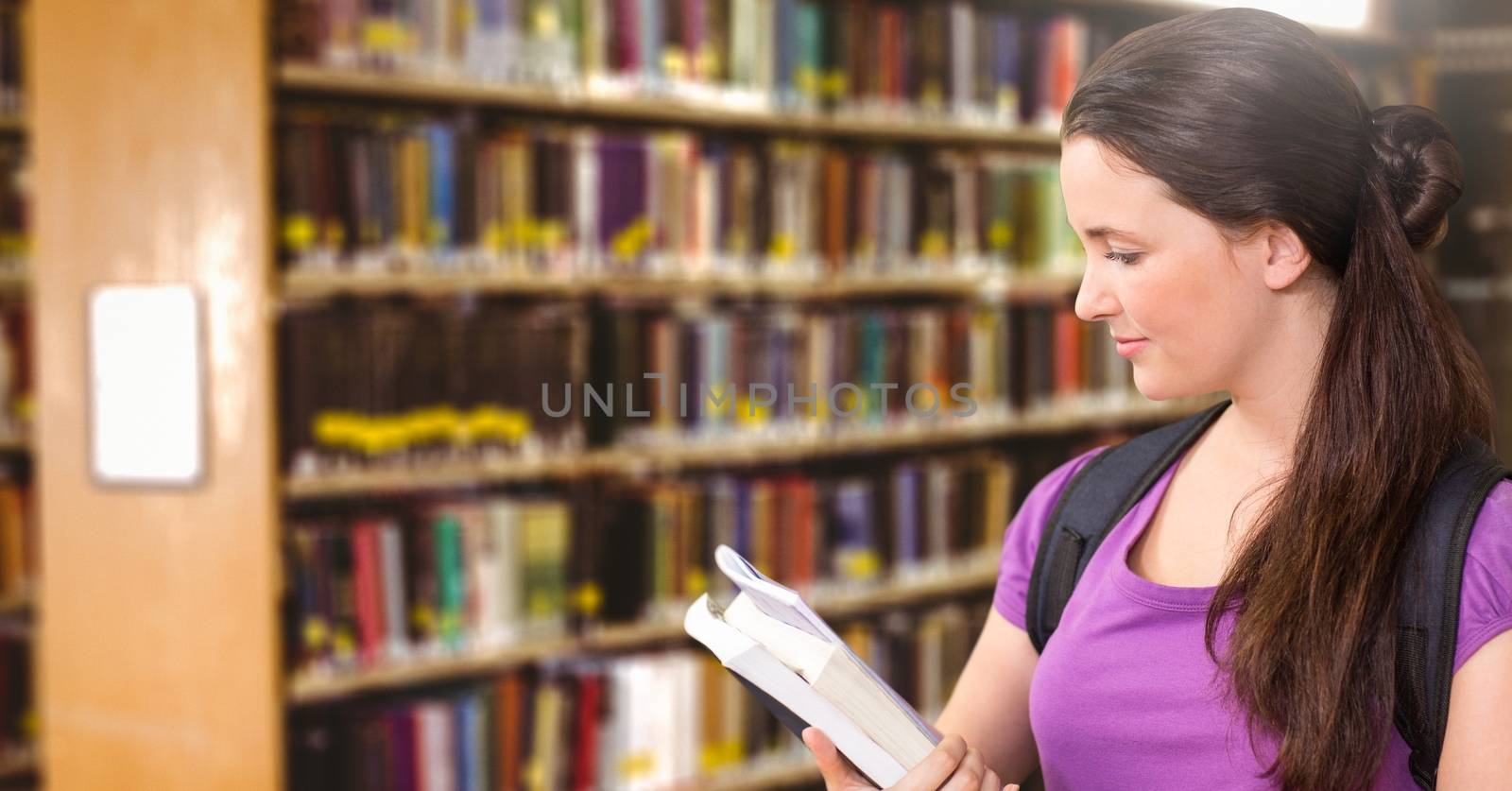 Student woman in education library by Wavebreakmedia