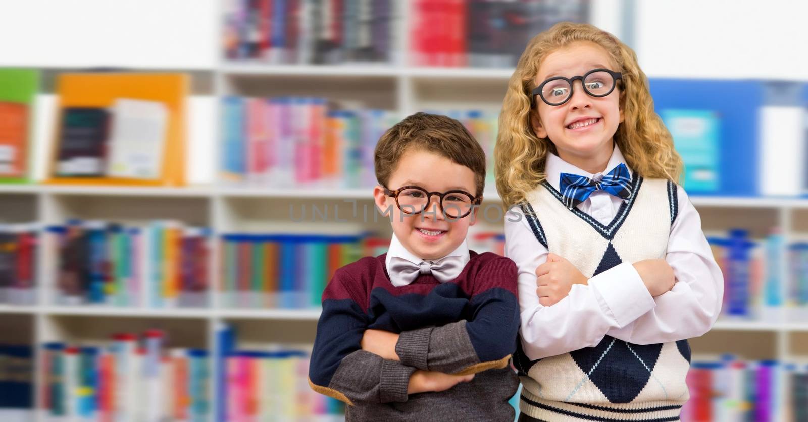 Boy and girl in education library by Wavebreakmedia