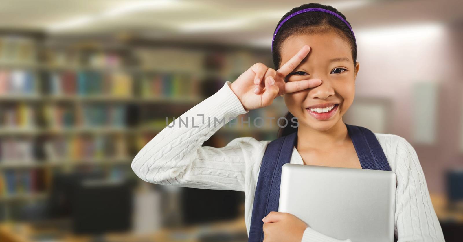 Girl in education library by Wavebreakmedia