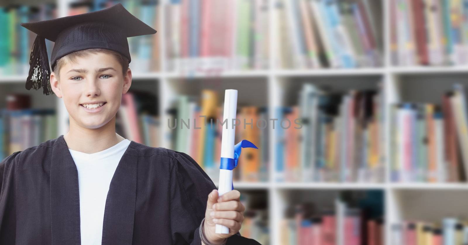 Student boy graduating in education library by Wavebreakmedia