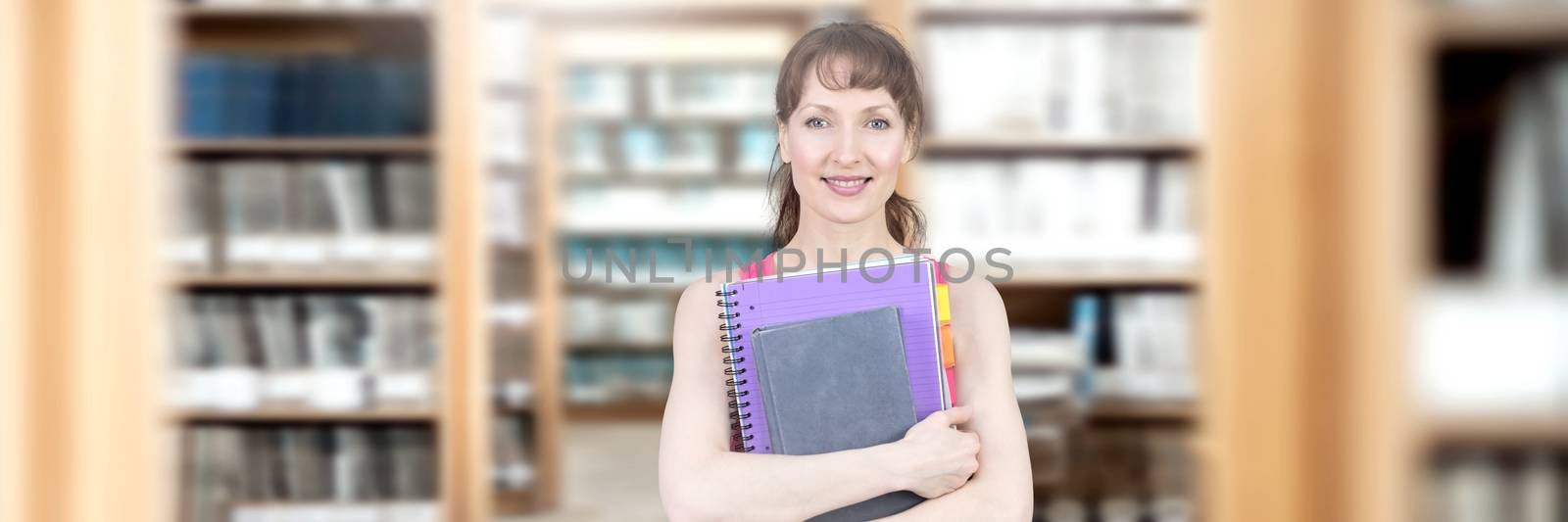 Digital composite of Student mature woman in education library