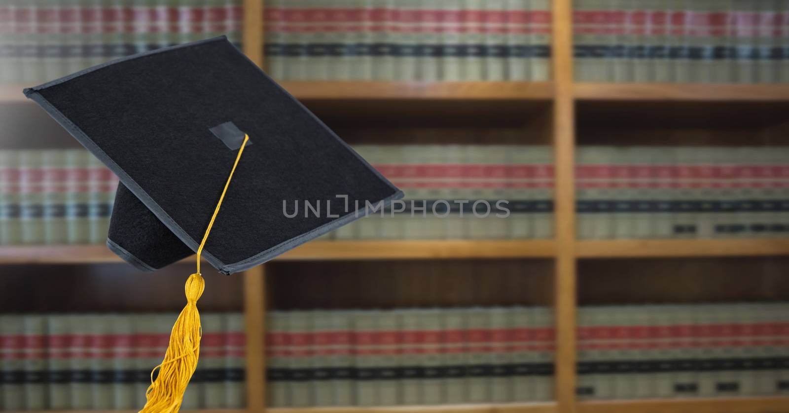 Digital composite of Graduation hat in education library