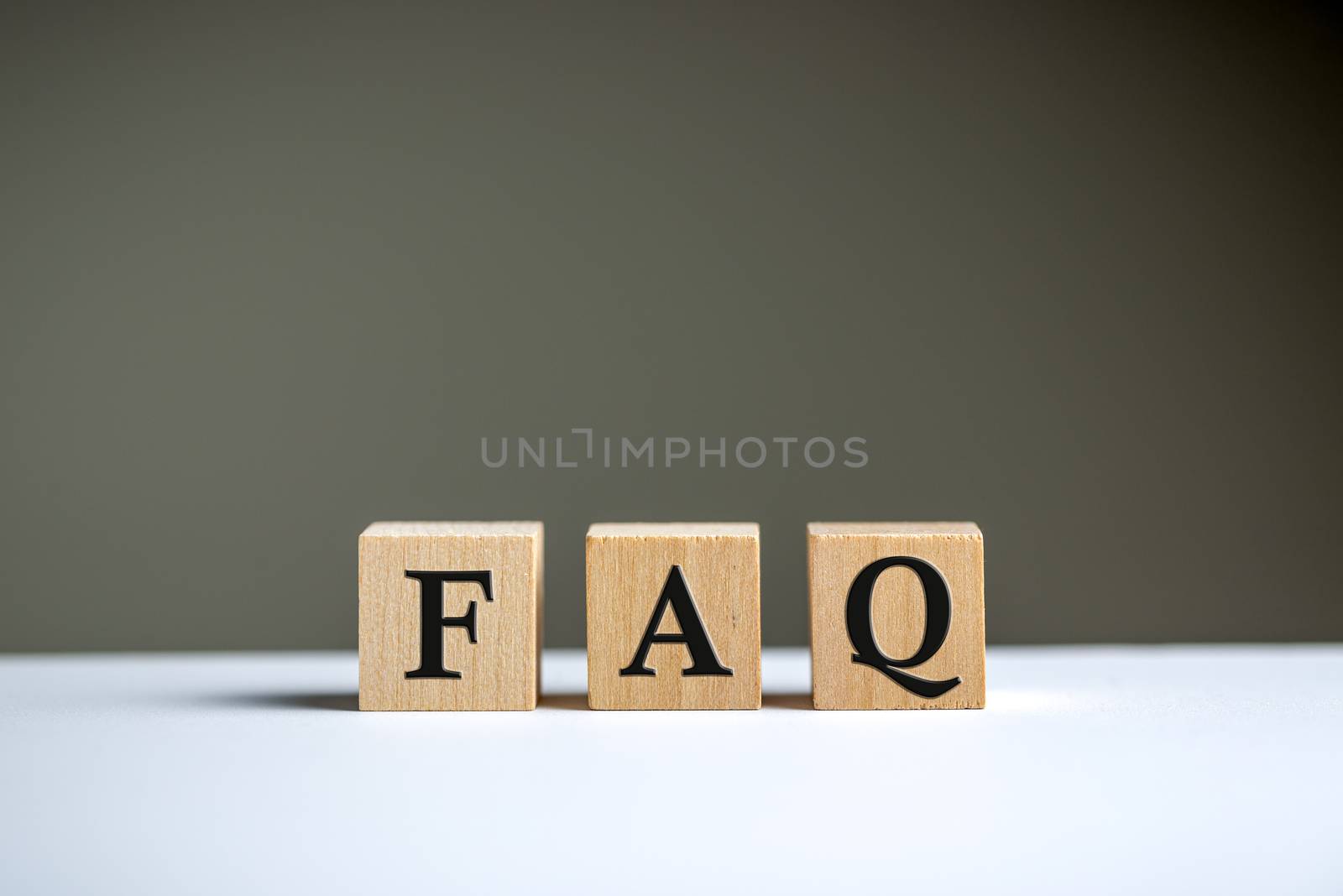FAQ word on wooden block cubes isolated