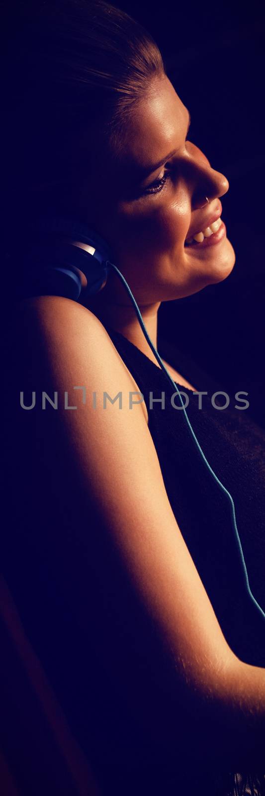 Side view of audio engineer using sound mixer at recording studio