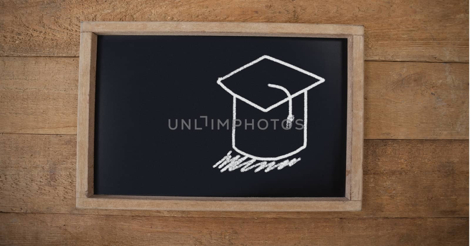 Graduation hat Education drawing on blackboard for school by Wavebreakmedia