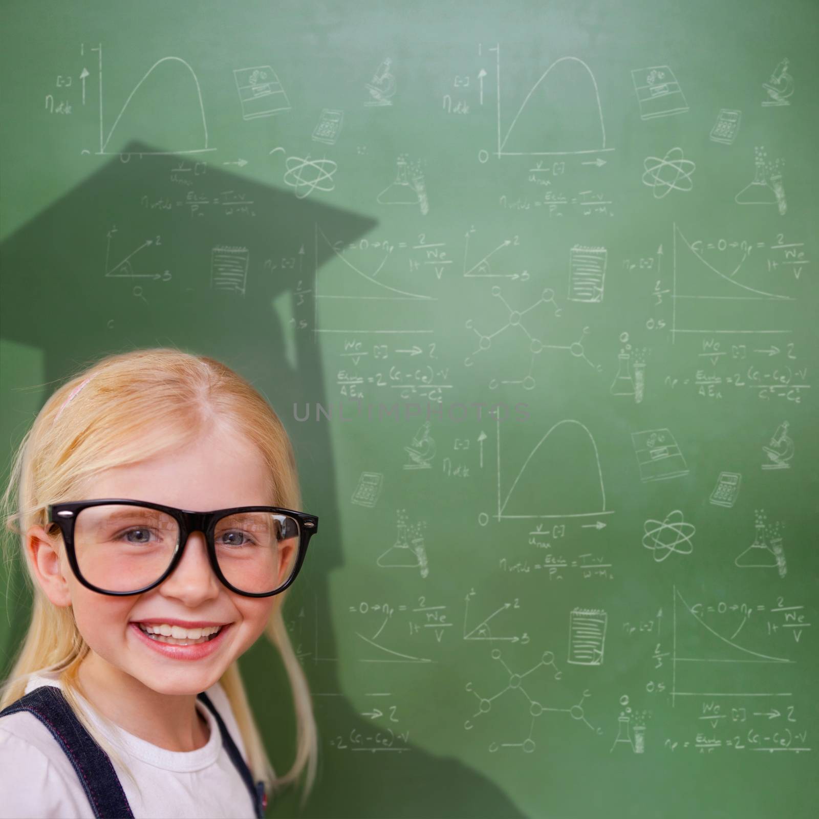 Composite image of cute pupil with graduate shadow in classroom