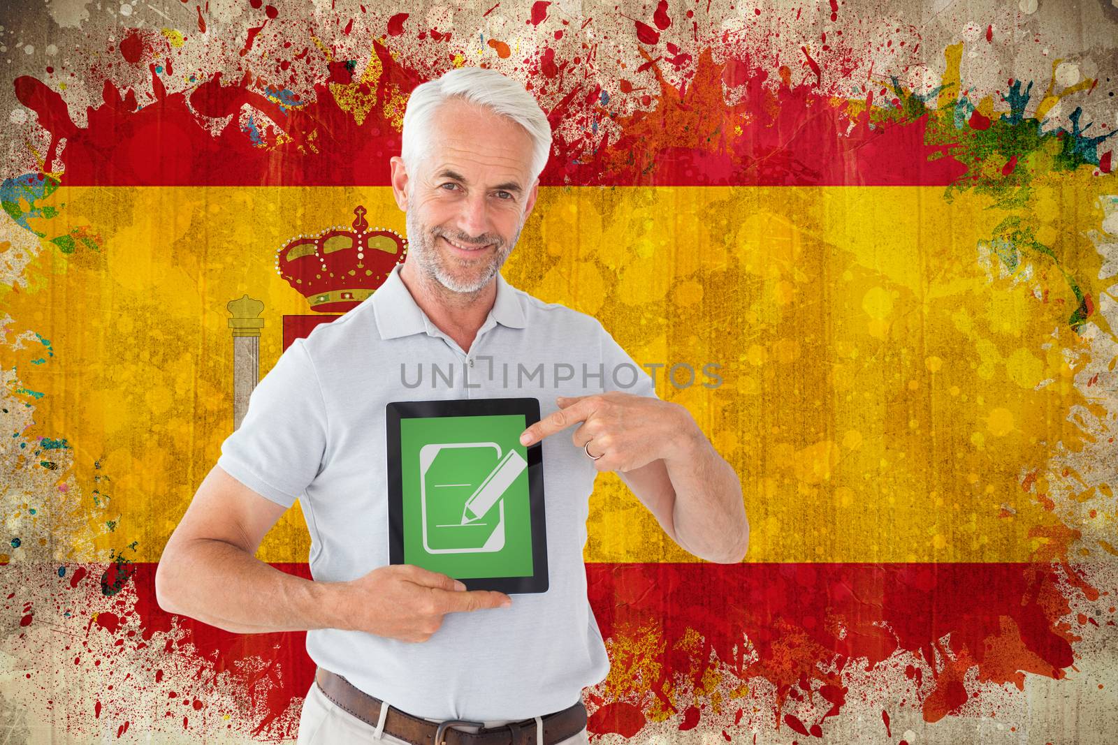 Mature student showing tablet pc against grunge spain flag