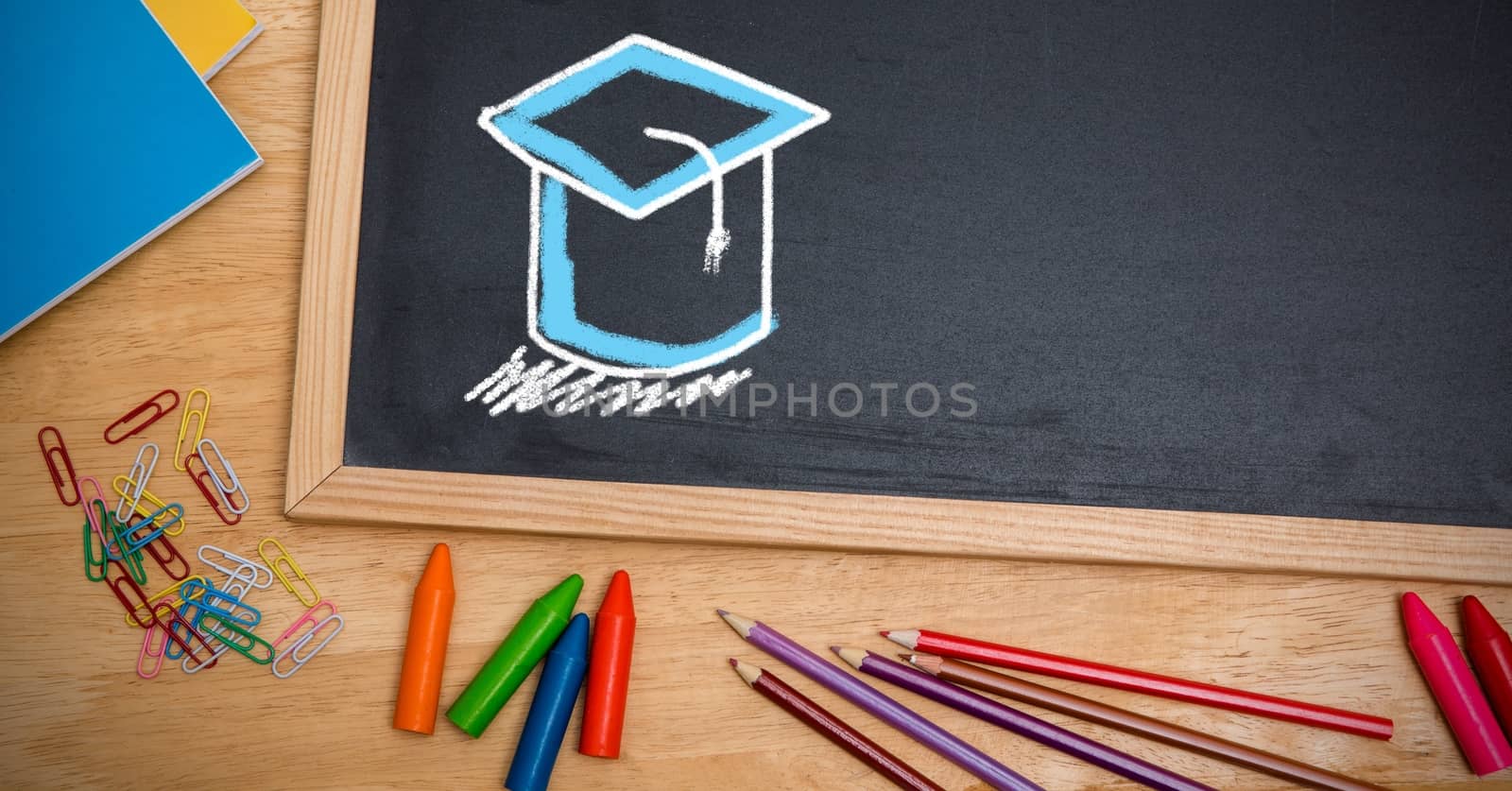 Digital composite of Graduation hat education drawings on blackboard for school