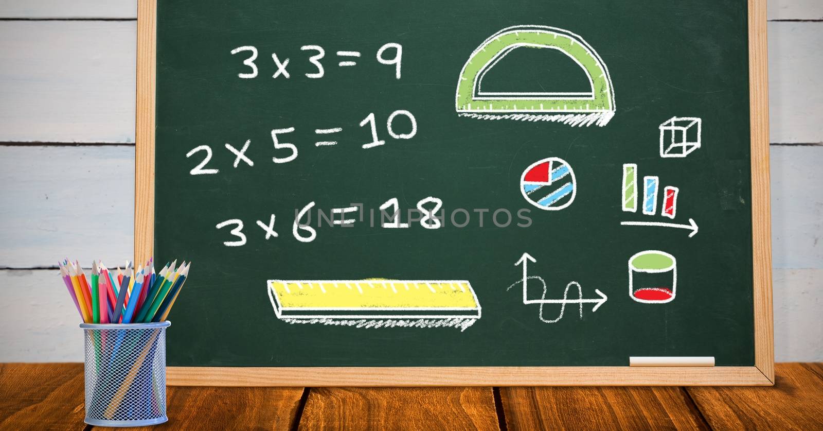 Math drawings on education blackboard in school by Wavebreakmedia