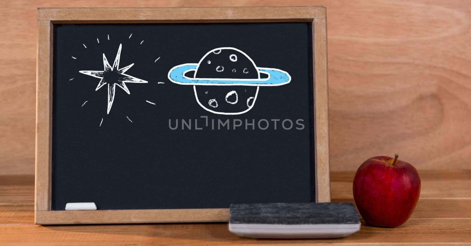 Digital composite of Planet and star education drawings on blackboard for school