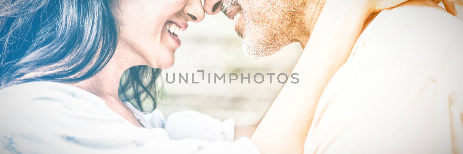 Close-up of happy couple embracing outdoors